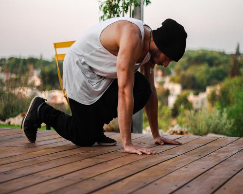Active person yoga stretching outdoors